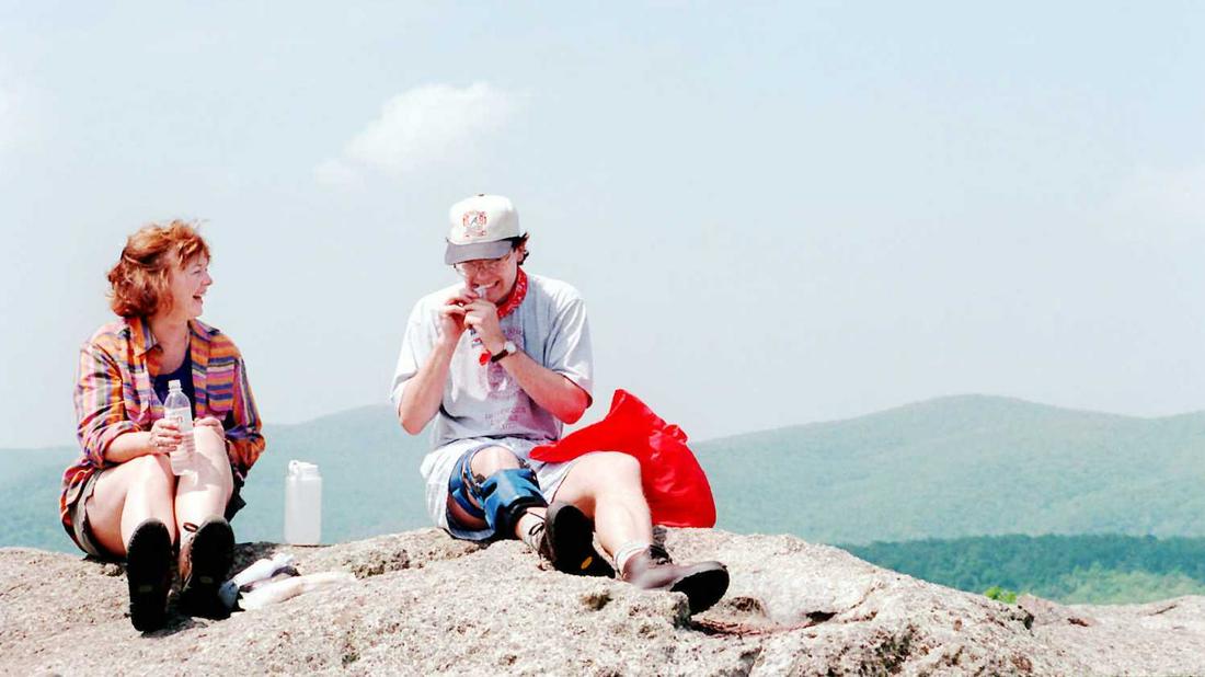 Martha Ezzard and her 25-year-old son John Jr. take a lunch break atop 3862-foot-high Spy Rock, which was used as a Confederate lookout during the Civil War. John was dubbed Bionic Man for his surgically reconstructed knee and accompanying knee brace. Photo: David Tulis