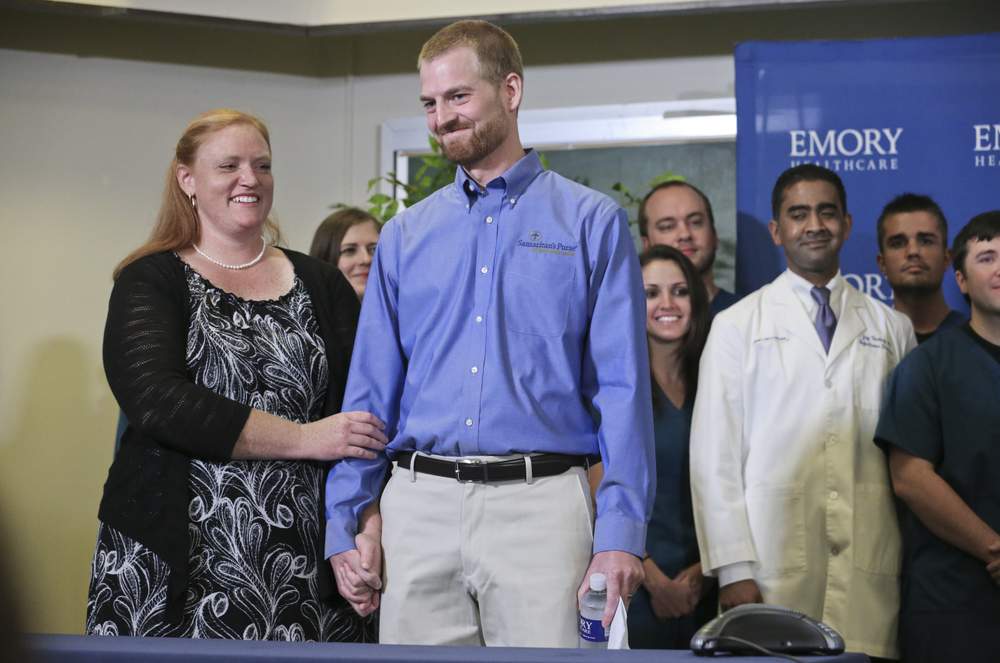 Amber and Kent Brantly at a news conference after he was released from Emory University Hospital last August. John Spink, jspink@ajc.com