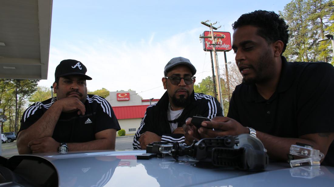 Byron Horne (left), Tyson Horne (center) and Ryon Horne, a video producer for The Atlanta Journal-Constitution, set up few cameras.