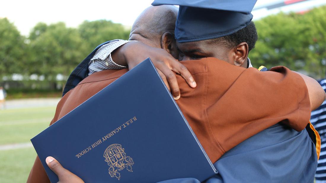 After his graduation ceremony, Coggins gets an emotional hug from his grandfather Freddie Johnson. Akili-Casundria Ramsess/Special