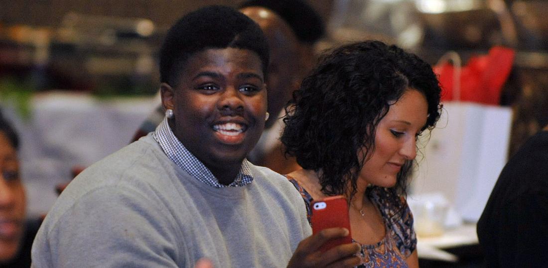 Walter Coggins Jr. attends a school event last month with Kayla Walker, Young Harris College Atlanta admissions coordinator. Kent D. Johnson/AJC
